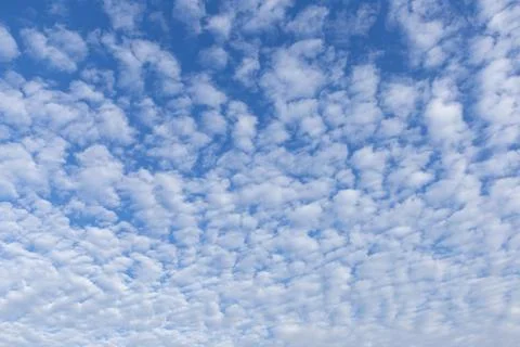 Blue sky background with white clouds on sunny day. Stock Photos