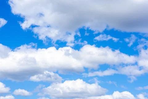 Blue sky background with white clouds. Stock Photos