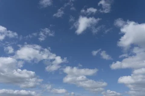 Blue sky background with white clouds Stock Photos