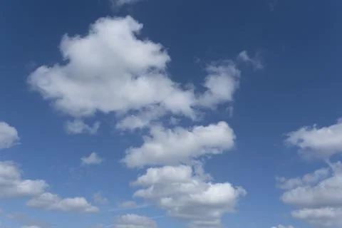 Blue sky background with white clouds Stock Photos