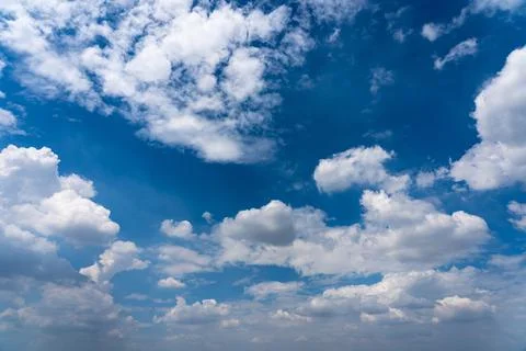 Blue sky background with white clouds floating Stock Photos