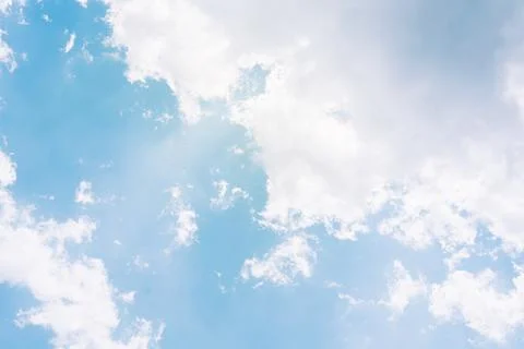 Blue sky background with white clouds and sun rays. cloudy sky ,Cumulus white Stock Photos