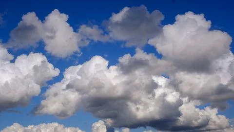 Blue sky background with white clouds closeup Stock Photos