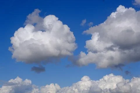 Blue sky background with white clouds closeup Stock Photos