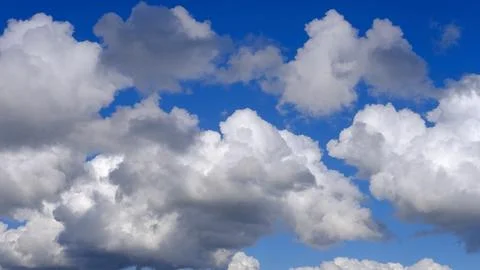 Blue sky background with white clouds closeup Stock Photos