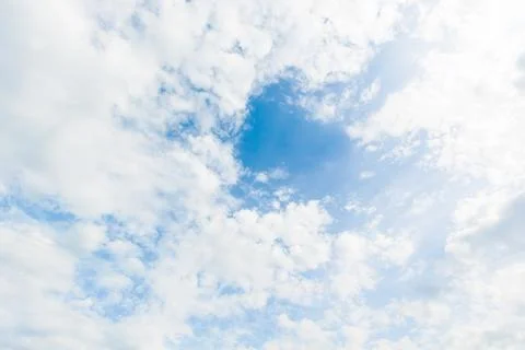 Blue sky background with white clouds cumulus floating soft focus. Stock Photos