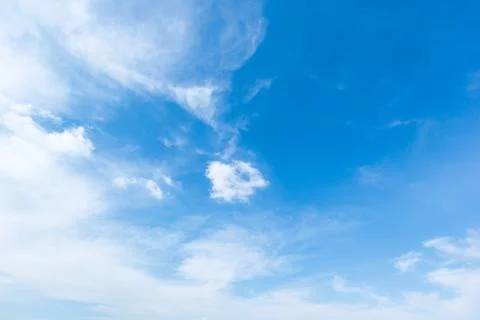 Blue sky background with white clouds cumulus floating soft focus. Stock Photos