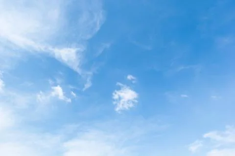 Blue sky background with white clouds cumulus floating soft focus. Stock Photos