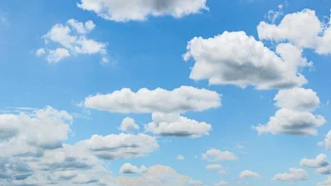 Blue sky background with white clouds cumulus floating soft focus, copy space Stock Photos