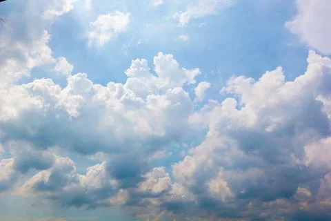 Blue sky background with white clouds cumulus floating soft focus. Stock Photos