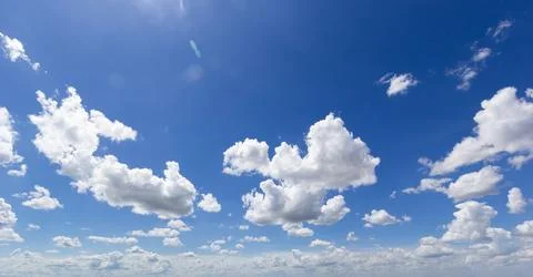 Blue sky background with white clouds cumulus floating soft focus, copy space Stock Photos