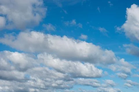 Blue sky background with white clouds Stock Photos