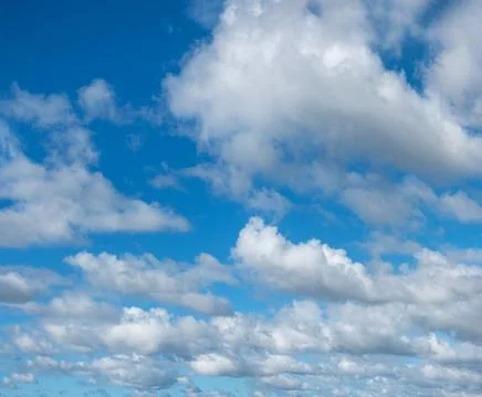 Blue sky background with white clouds Stock Photos