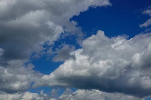 Blue sky background with white clouds Stock Photos