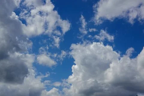 Blue sky background with white clouds Stock Photos