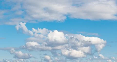 Blue sky background with white clouds. Sky clouds in sunny day Stock Photos