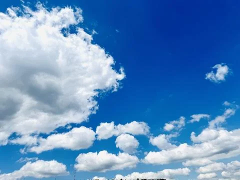 Blue Sky Background With White Clouds on Sunny Day. Stock Photos