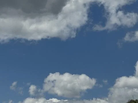 Blue Sky Background With White Clouds on Sunny Day Stock Photos