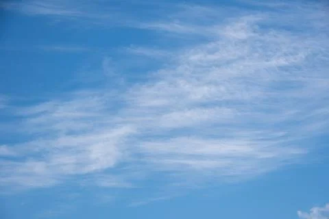 Blue sky background with white fluffy cumulus clouds. Panorama of white fluff Stock Photos