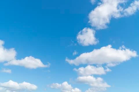 Blue sky background with white soft clouds with copy space Stock Photos
