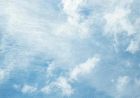 Blue sky background with white transparent clouds Stock Photos