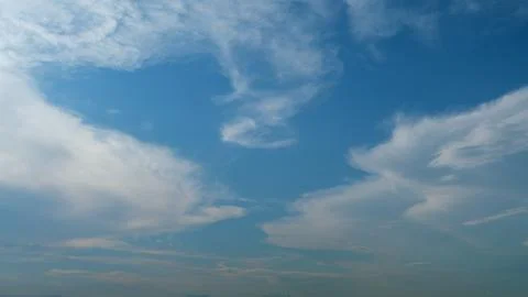 Blue sky with beautiful cirrocumulus clouds. Beautiful sunny blue sky background Stock Photos