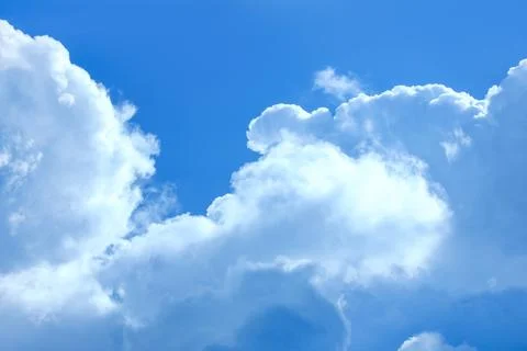 Blue sky with beautiful fluffy clouds as background Stock Photos