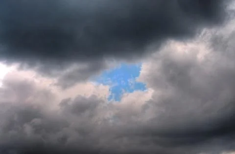 The Blue Sky Behind Thick Clouds Stock Photos