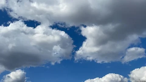 Blue sky big white clouds. Puffy fluffy clouds. Cumulus cloud cloudscape time Stock Footage 237807787