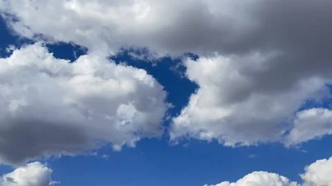 Blue sky big white clouds. Puffy fluffy clouds. Cumulus cloud cloudscape time Stock Footage 237925221