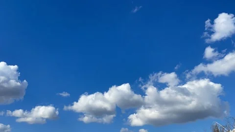 Blue sky big white clouds. Puffy fluffy clouds. Cumulus cloud cloudscape time Stock Footage 238661606