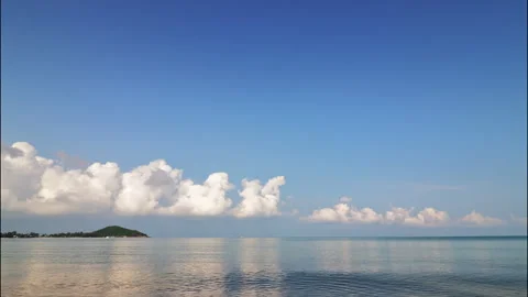 Blue sky with big white clouds over the sea. Time lapse. Stock Footage 332397988