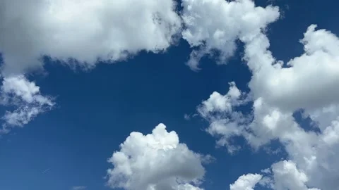 Blue sky with big white clouds. Puffy fluffy clouds. Cumulus cloud cloudscape Stock Footage 346689848