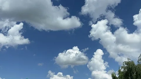 Blue sky with big white clouds. Puffy fluffy clouds. Cumulus cloud cloudscape Stock Footage 346691320