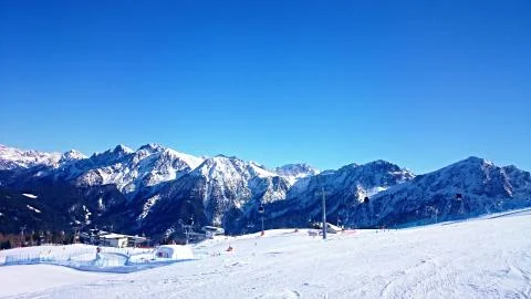 Blue sky, cable car, snow, Alps, moutains Stock Photos