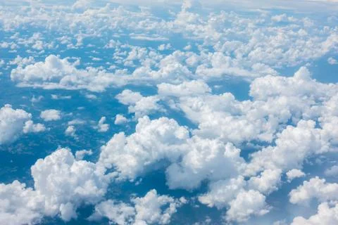 Blue sky with cloud from airplane window Stock Photos