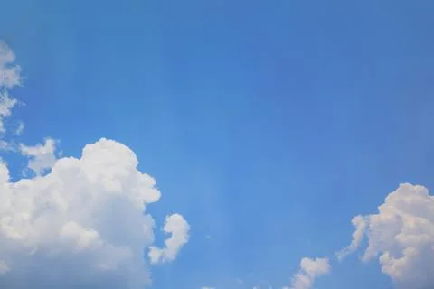 Blue sky with cloud and sun rays background Stock Photos