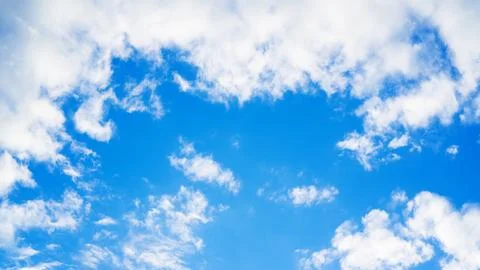 Blue sky with a cloud for a background. Stock Photos