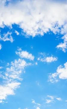 Blue sky with a cloud for a background. Stock Photos