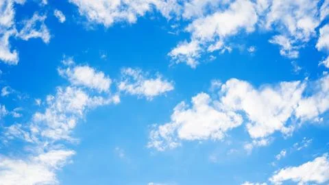 Blue sky with a cloud for a background. Stock Photos