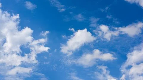 Blue sky with cloud background.White fluffy clouds in sunny day. Stock Photos