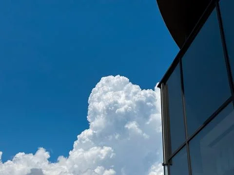 Blue sky with cloud behind the building Stock Photos
