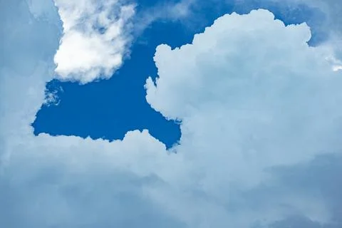 A blue sky with a cloud in the middle Stock Photos