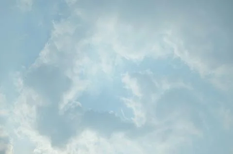 Blue sky with a cloud. Stock Photos