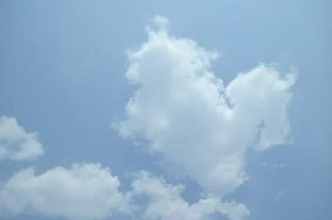 Blue sky with a cloud. Stock Photos