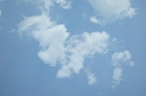 Blue sky with a cloud. Stock Photos