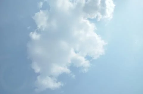 Blue sky with a cloud. Stock Photos