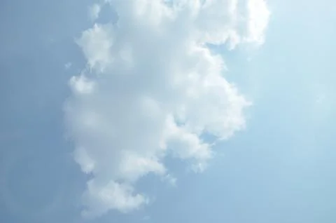 Blue sky with a cloud. Stock Photos