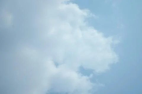 Blue sky with a cloud. Stock Photos
