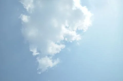 Blue sky with a cloud. Stock Photos